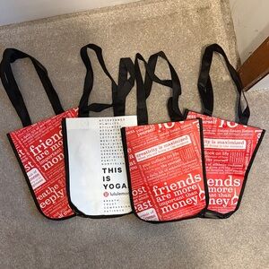 Four Lululemon shopper bags